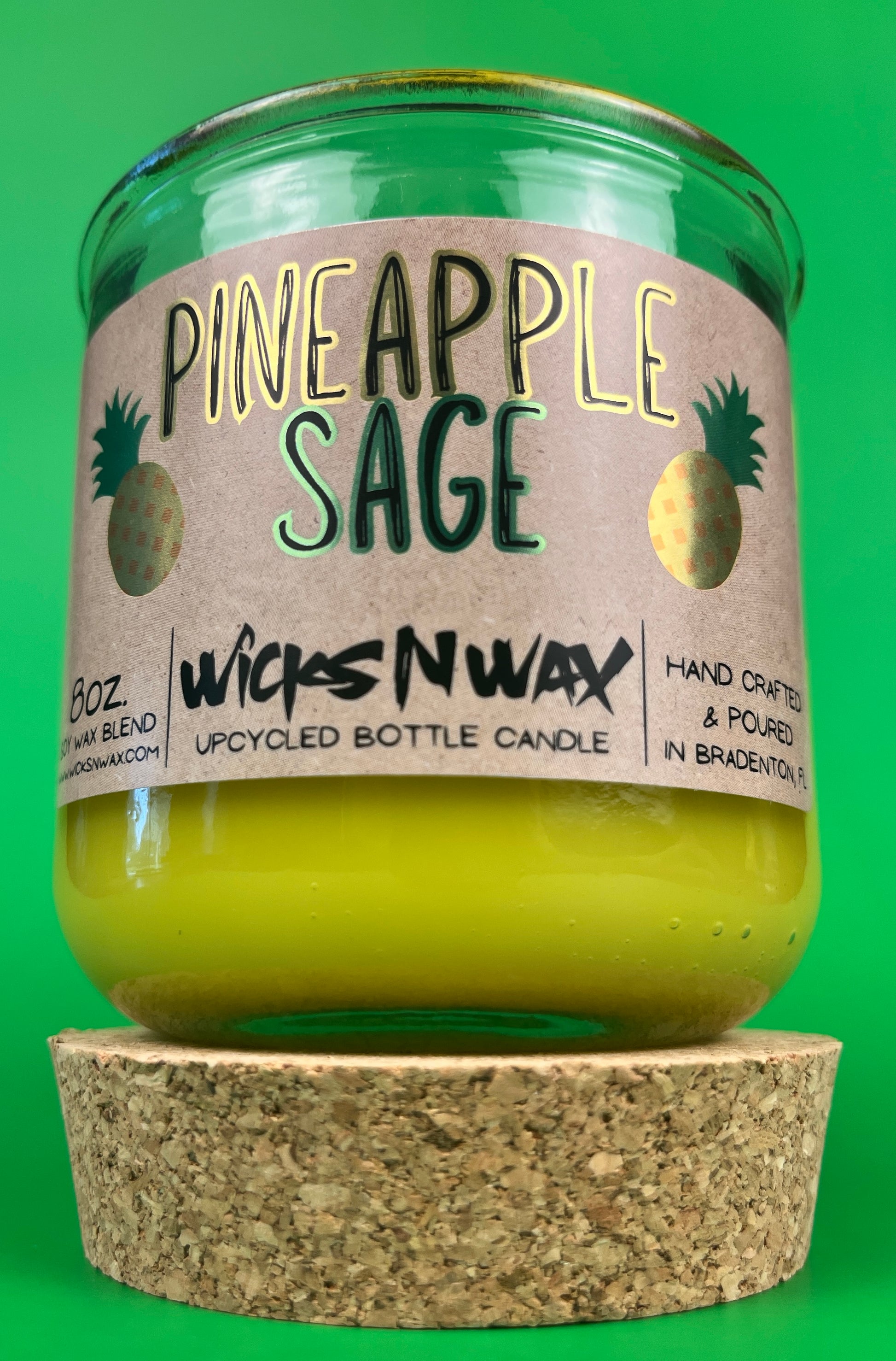 Pineapple Sage recycled glass candle with green jar and cork base, yellow wax and label