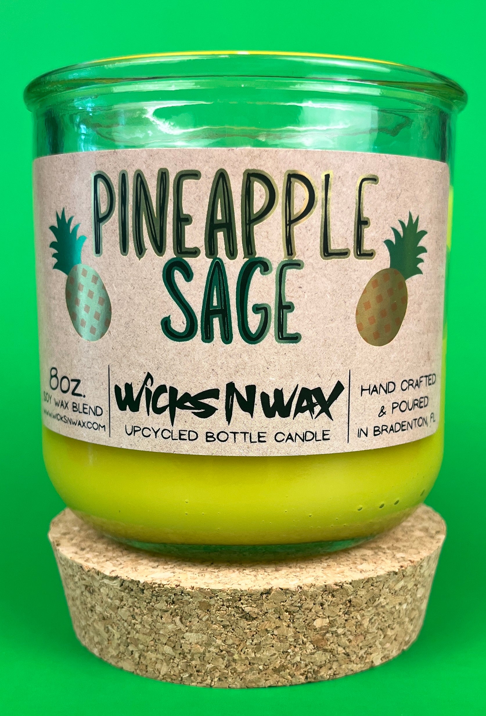 Pineapple Sage recycled glass candle with cork base, green jar, and yellow wax