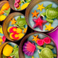 Sea-themed tin candle with starfish, turtle, shell and coral wax decorations