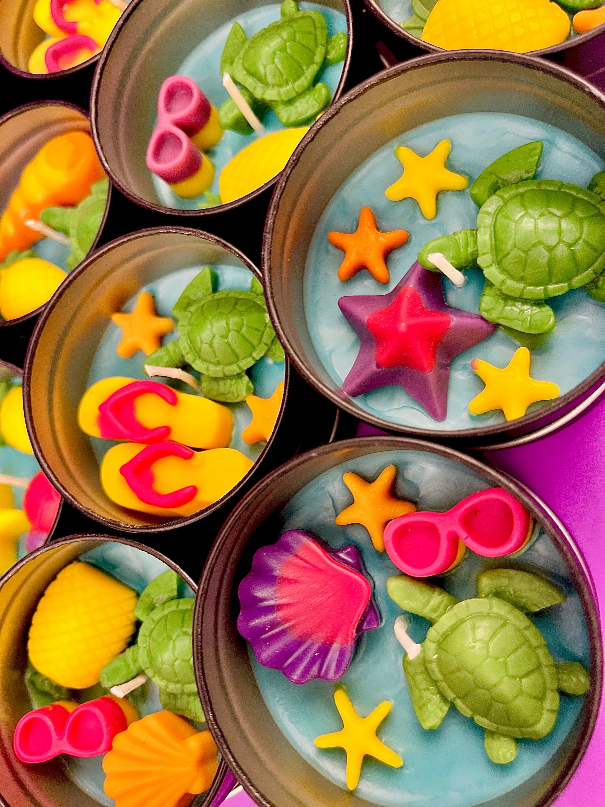 Sea-themed tin candle with starfish, turtle, shell and coral wax decorations