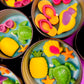 Small sea-themed wax tins with seashells, starfish, and green turtle in blue wax