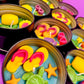 Small sea-themed wax tin close-up with heartlike shapes, starfish, and green turtle
