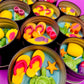 Small sea-themed wax tins with pink coral shapes, starfish, and green sea turtles