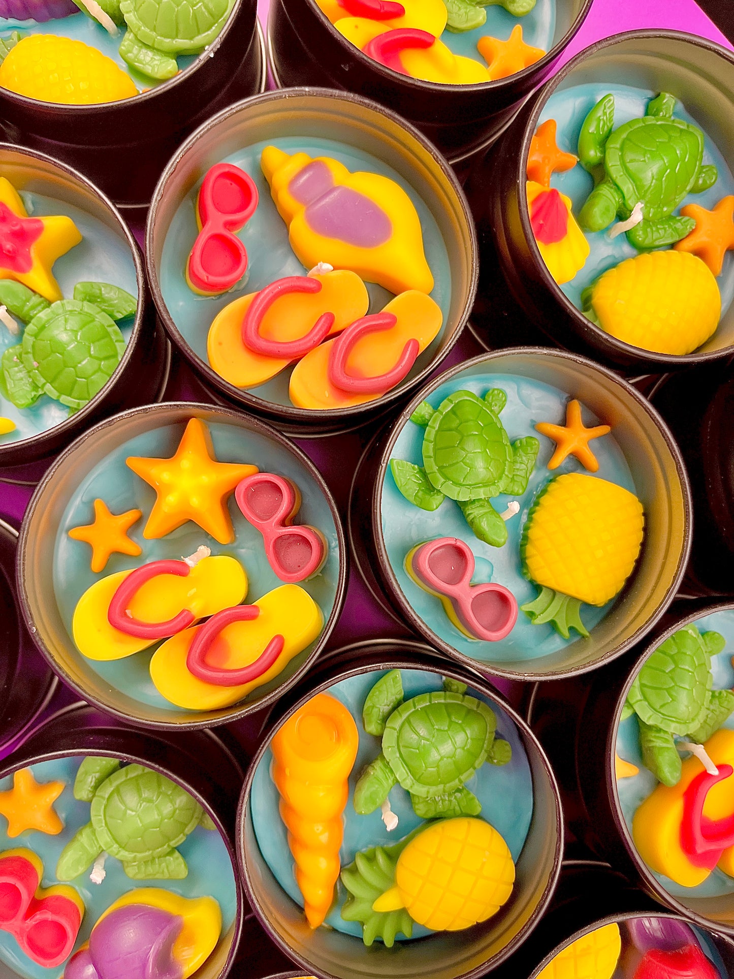 Small sea-themed wax tins featuring starfish, conch shells, and green sea turtles