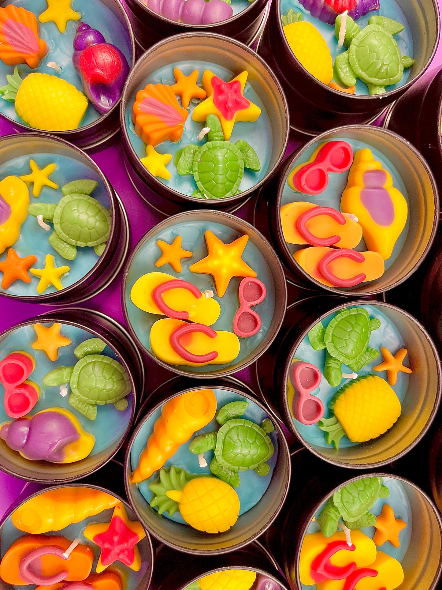 Small sea-themed wax tins with starfish, pink seashells, and green turtle shapes