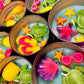 Small WicksNWax sea art tins with starfish, sea turtle, colorful shell, and tentacle wax