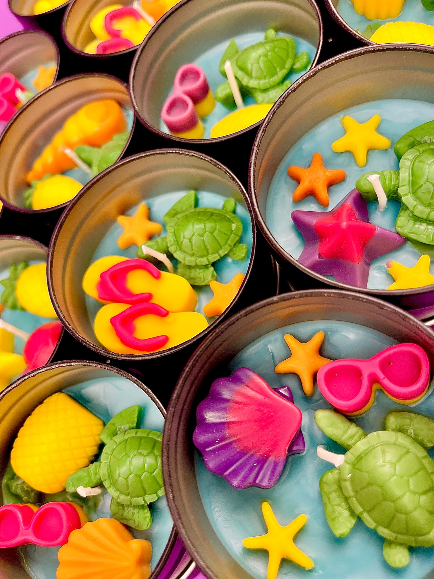 Small WicksNWax sea art tins with starfish, sea turtle, colorful shell, and tentacle wax