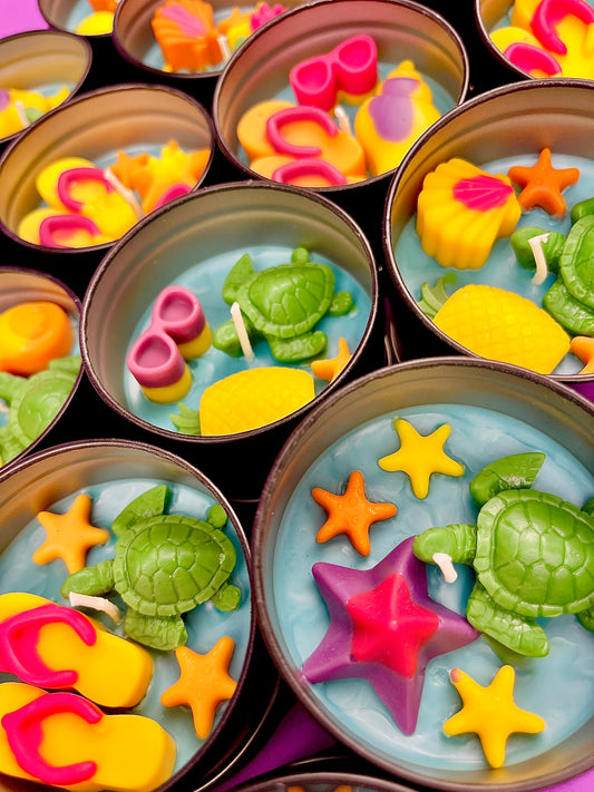 Small WicksNWax sea art tins with blue wax melts, green turtles, and orange starfish