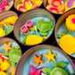 Small WicksNWax sea art tins with blue wax melts, turtles, starfish, and shell pieces