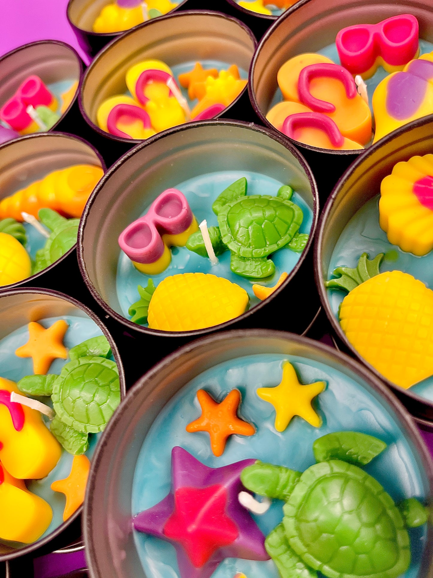 Small WicksNWax sea art tins with blue wax melts, turtles, starfish, and shell pieces