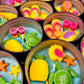 Small WicksNWax sea art tins with blue wax, starfish, turtles, and purple shell shapes