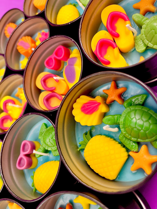 Small WicksNWax sea art tin set with colorful starfish, turtles, and shell-shaped wax