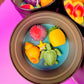 Small round wax melt tin with sea turtle, yellow scallop, starfish, and pink wax pieces