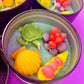Large Sea Art tin with turtle, orange shell, and coral-flower wax pieces