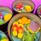 Metal candle tin set with sea-themed wax shapes in yellow, purple, green, and red