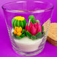 WicksNWax cactus art candle with yellow cactus and pink flower wax inside clear glass