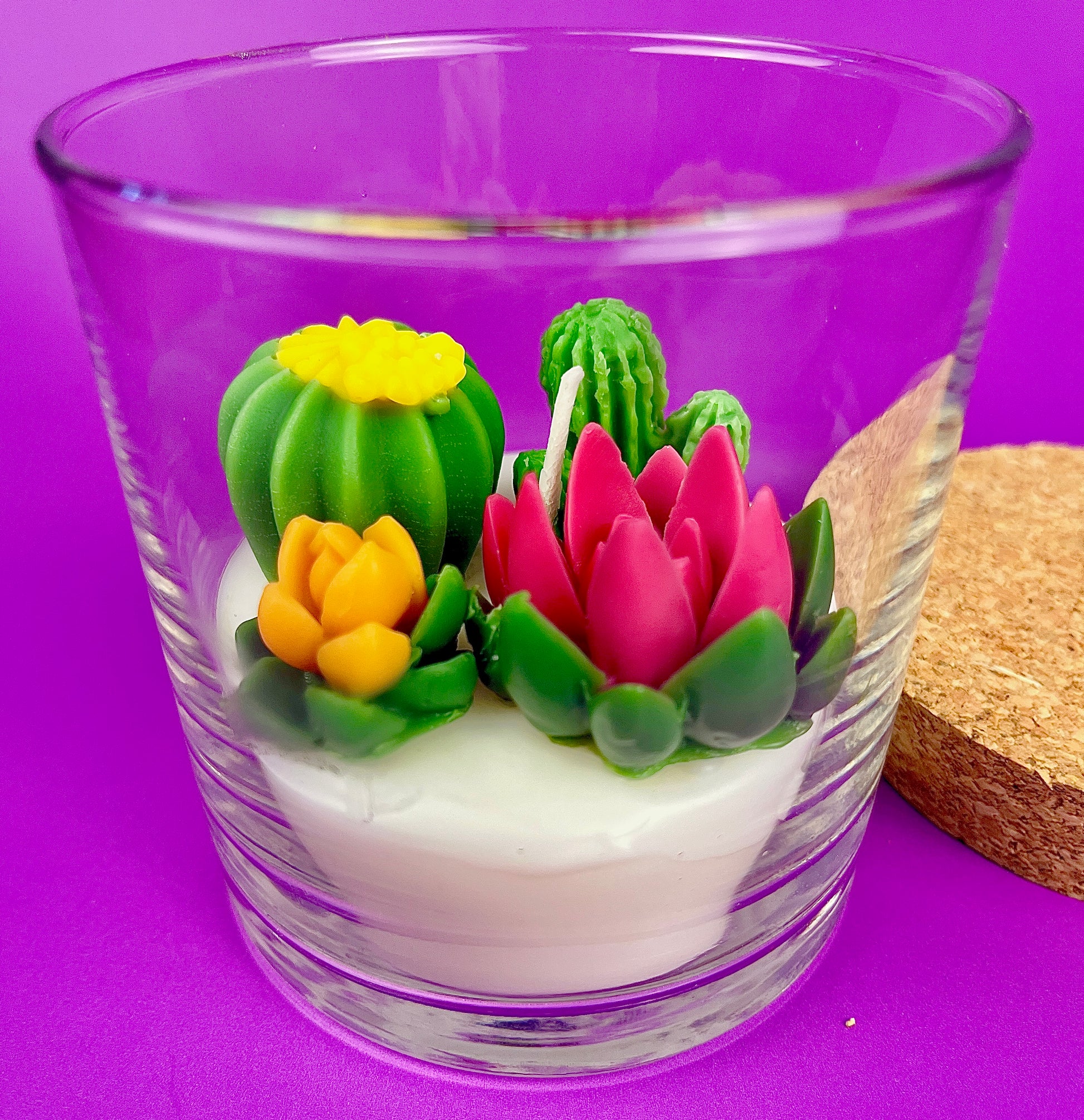WicksNWax cactus art candle with yellow cactus and pink flower wax inside clear glass