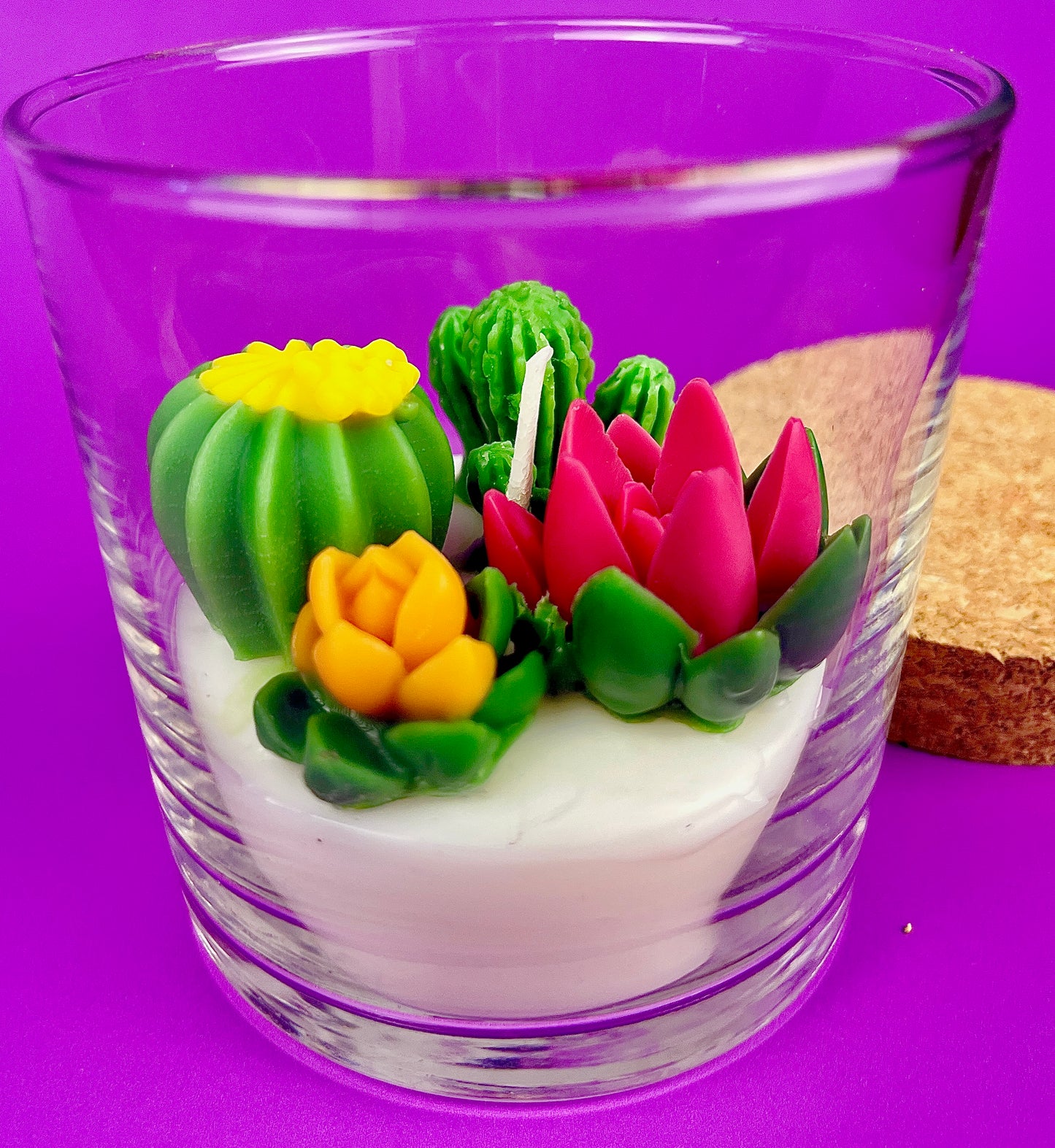WicksNWax cactus art candle with tall pink tulip-style wax and green cactus in clear glass