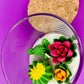 WicksNWax cactus art candle with cork lid and red rose-like and green cactus wax in glass