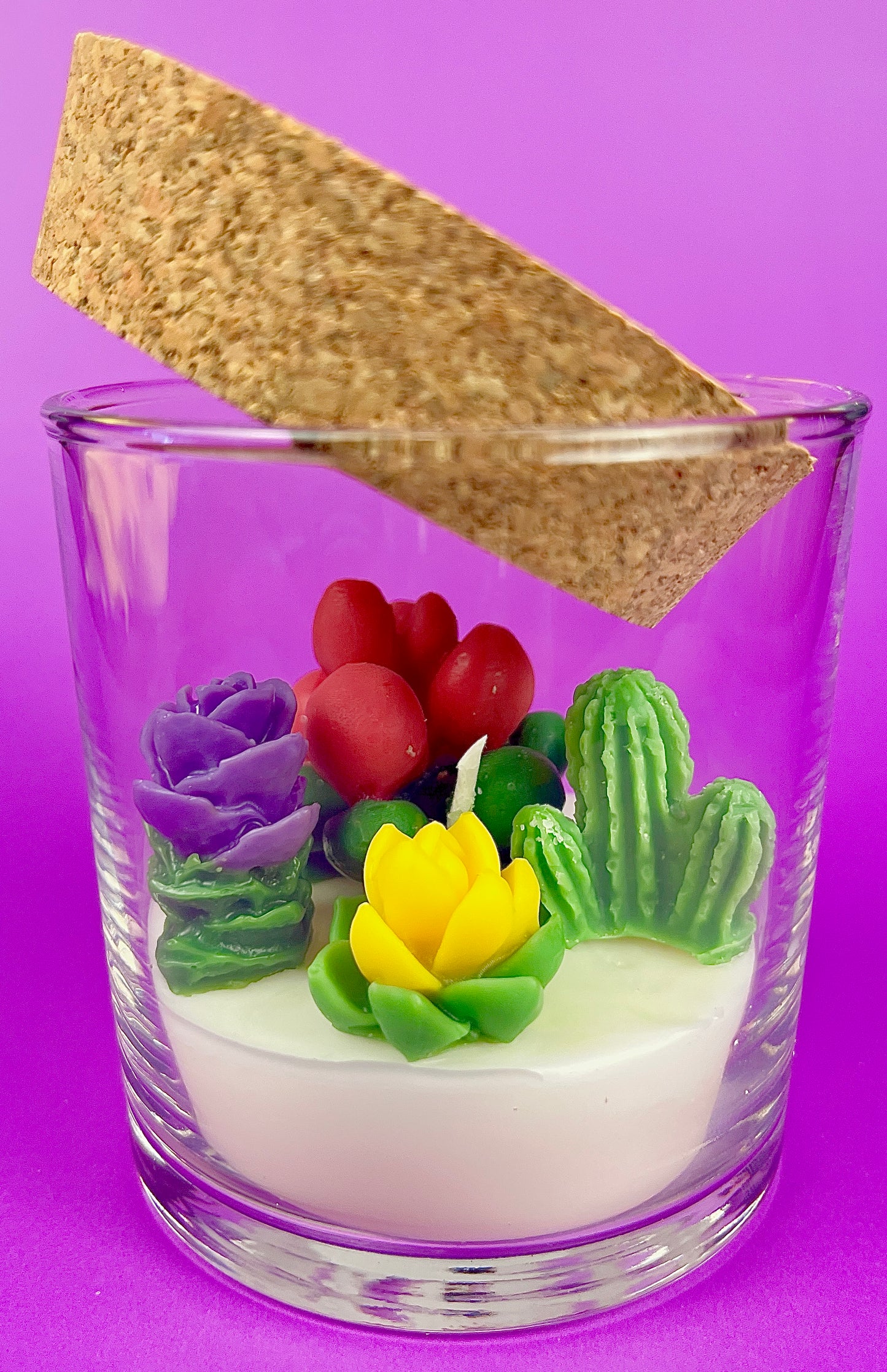 Small cactus art candle with cork lid; clear glass with colorful cactus flower wax