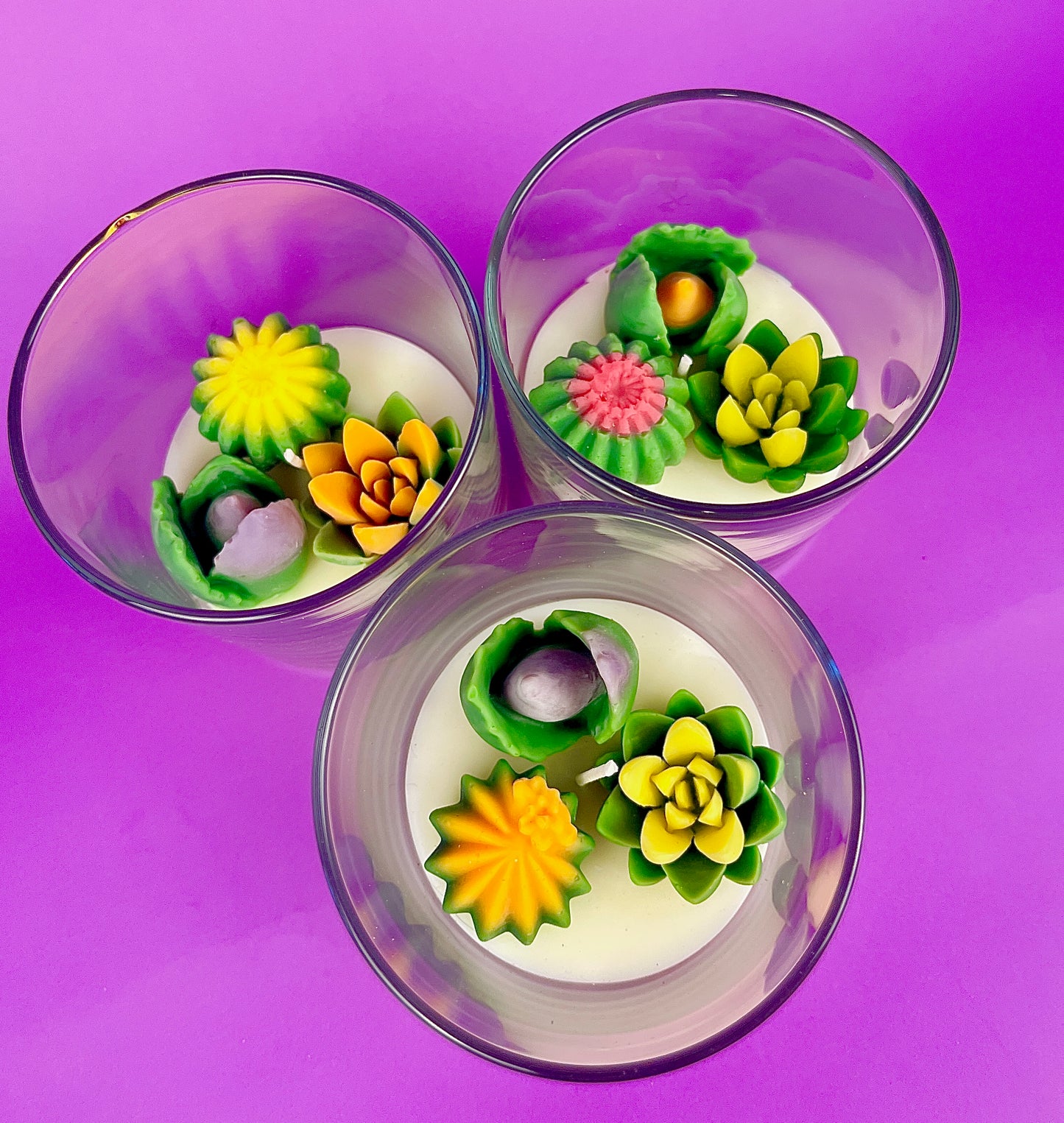 Small cactus art candle set: three clear cups with cactus and flower wax toppers