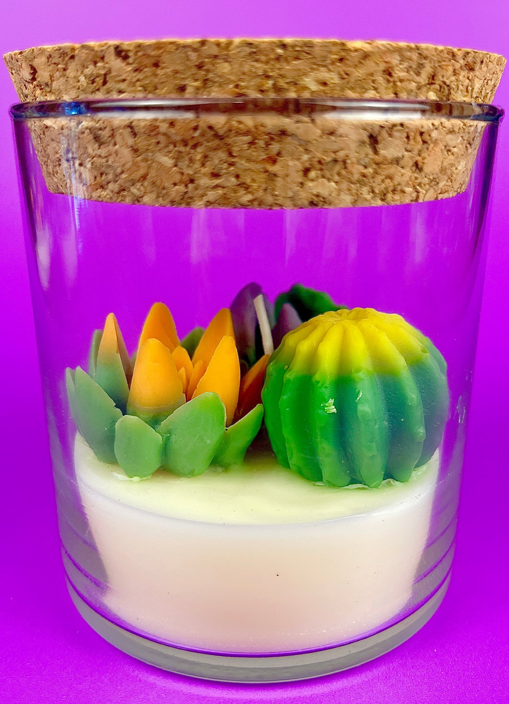 Small cactus art candle with cork lid; clear glass with green and yellow cactus wax