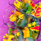 Small scented candle set in clear glass jars with assorted bright sea-shaped wax pieces