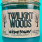 Recycled glass candle in teal jar with WicksNWax Twilight Woods label