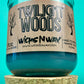 Blue glass candle jar with Twilight Woods label and cork base
