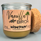 Vanilla Birch recycled glass candle with tan wax, kraft label, and cork lid