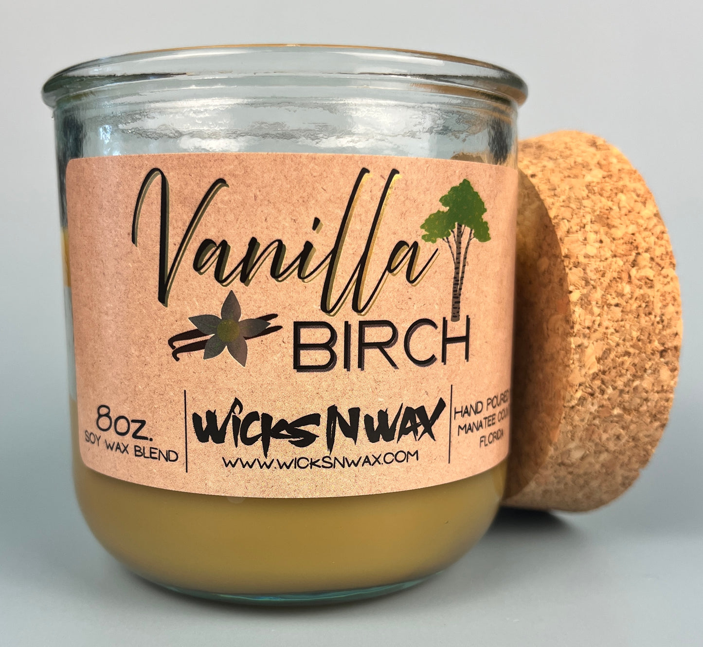 Vanilla Birch recycled glass candle with tan wax, kraft label, and cork lid