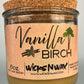 Vanilla Birch recycled glass candle with tan wax and cork lid, clear glass jar, kraft label