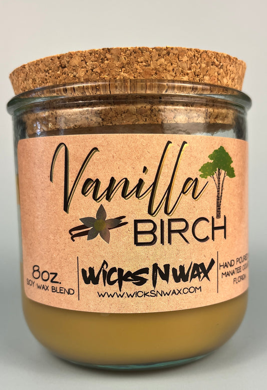 Vanilla Birch recycled glass candle with tan wax and cork lid, clear glass jar, kraft label