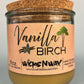 Vanilla Birch recycled glass candle with tan wax, clear glass jar, and cork lid