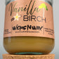 Vanilla Birch recycled glass candle with tan wax, clear jar, kraft label, and cork base
