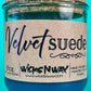 Velvet Suede candle in a glass jar with metal lid, label shows WicksNWax and 8oz
