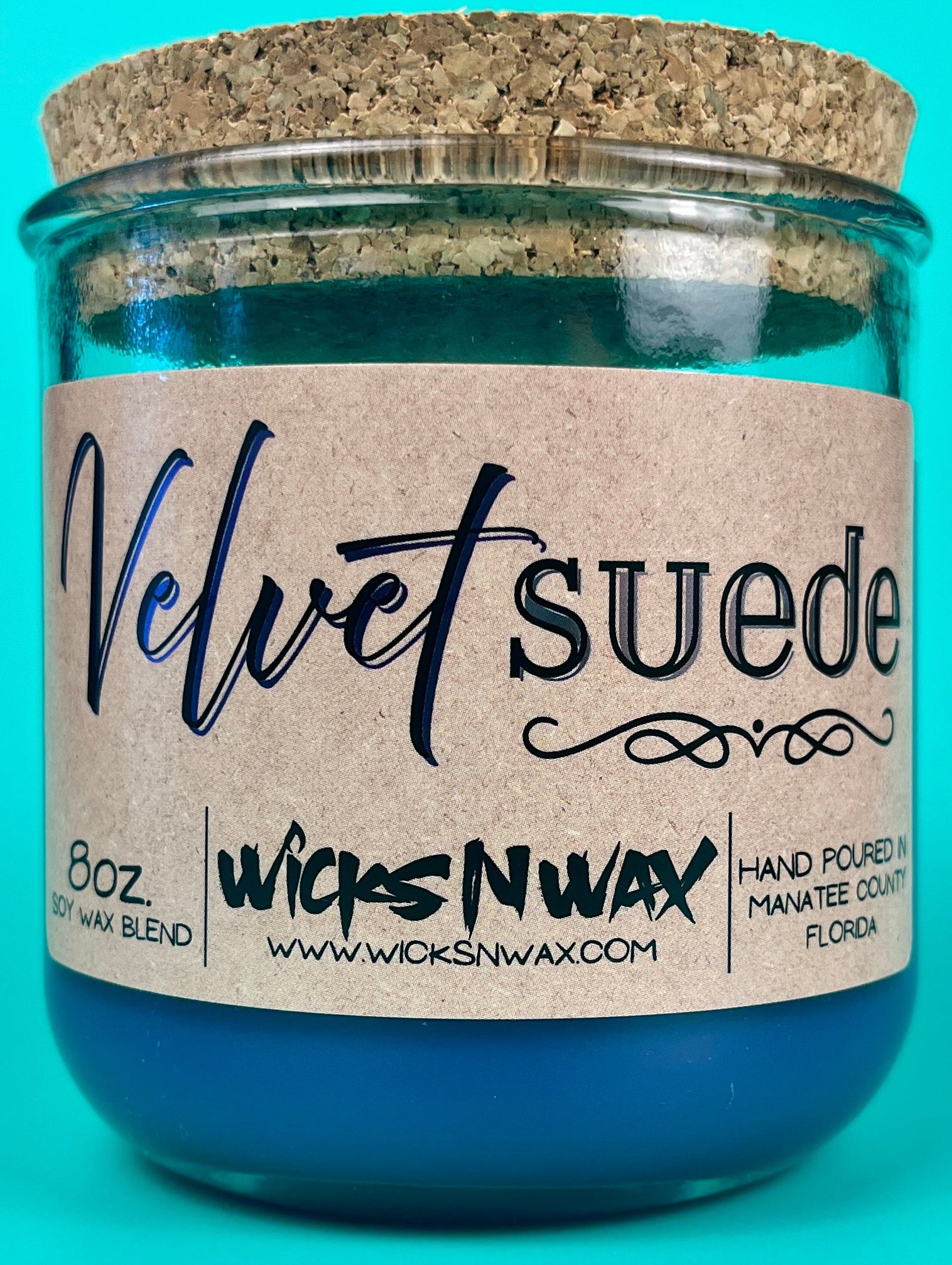 Velvet Suede candle in a glass jar with metal lid, label shows WicksNWax and 8oz