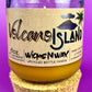 Recycled glass candle jar with Volcano Island label, yellow wax, cork base