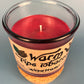 Glass jar candle top view with red wax and centered wick, leaf-and-smoke label