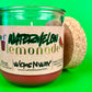 Recycled glass candle jar with red wax, watermelon lemonade label, cork coaster