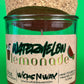 Recycled glass candle jar with red wax, watermelon lemonade label, cork base top view