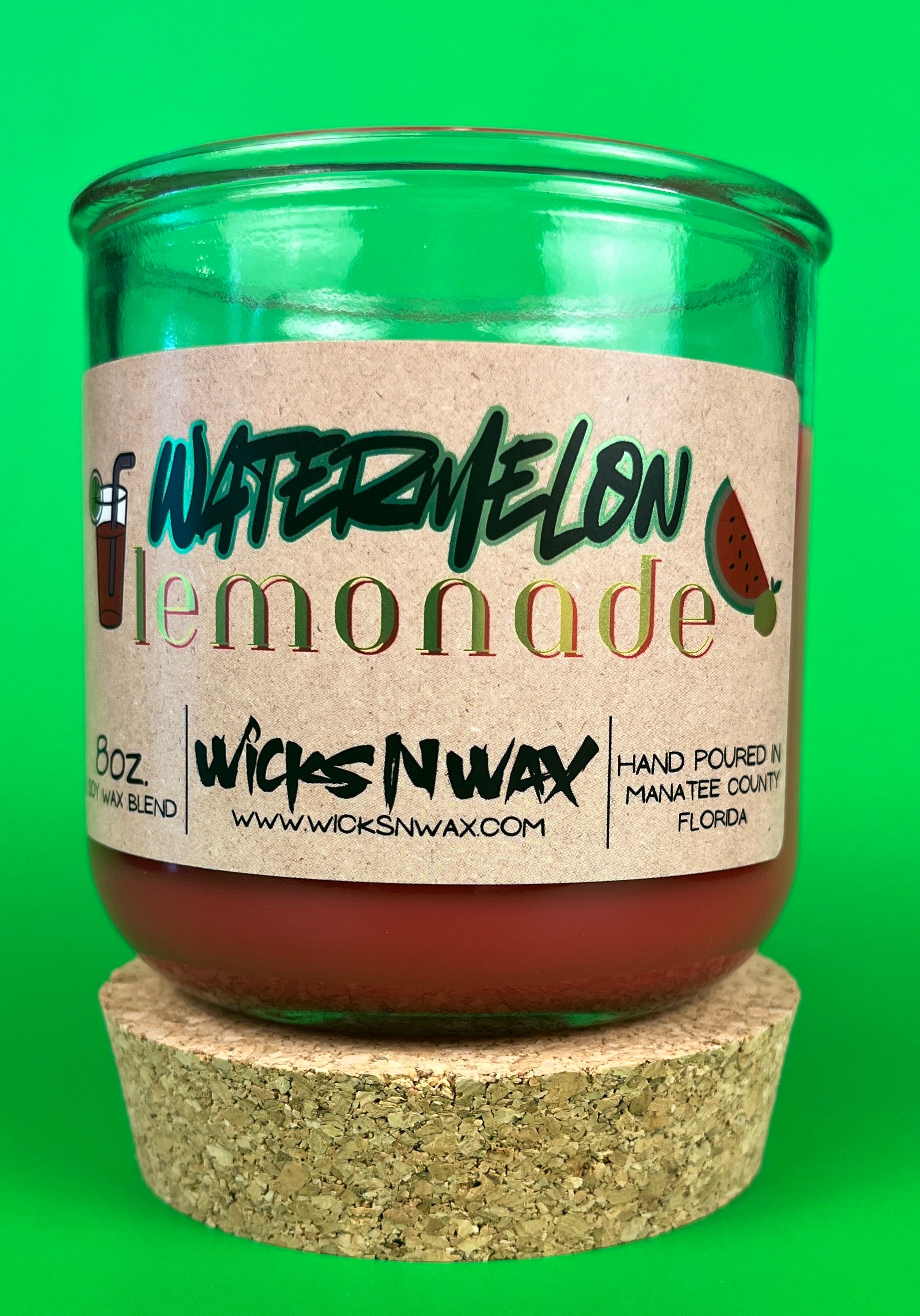 Glass candle jar with red wax and cork base, watermelon lemonade label on front