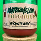 Recycled glass candle with red wax and wick, watermelon lemonade label, cork coaster