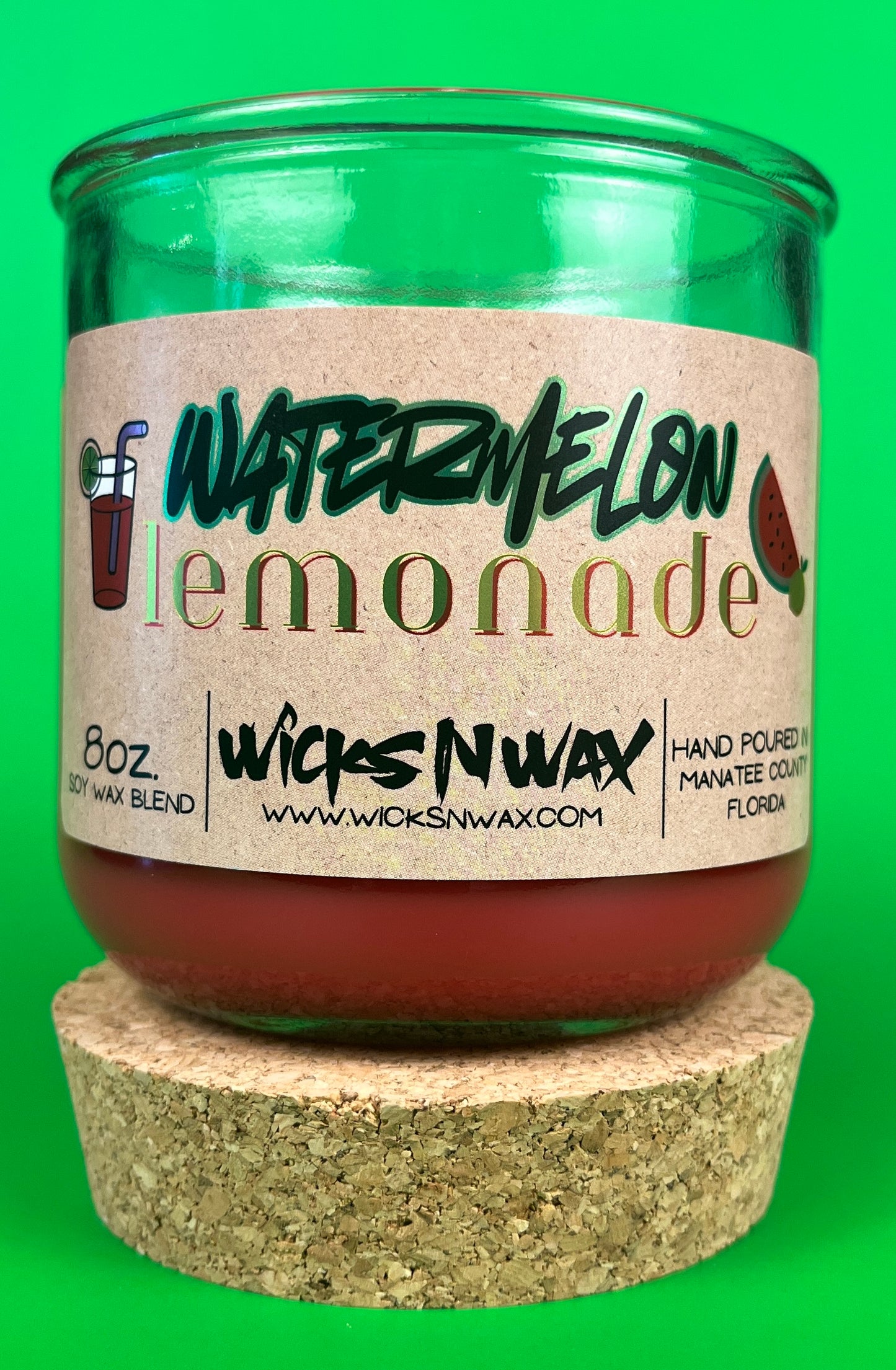 Recycled glass candle with red wax and wick, watermelon lemonade label, cork coaster