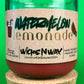 Recycled glass candle with red wax, watermelon lemonade label, cork base