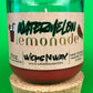 Recycled glass candle jar with red wax, watermelon lemonade label, on cork base