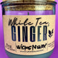 Recycled glass candle in clear jar with beige label reading 'White Tea & Ginger'