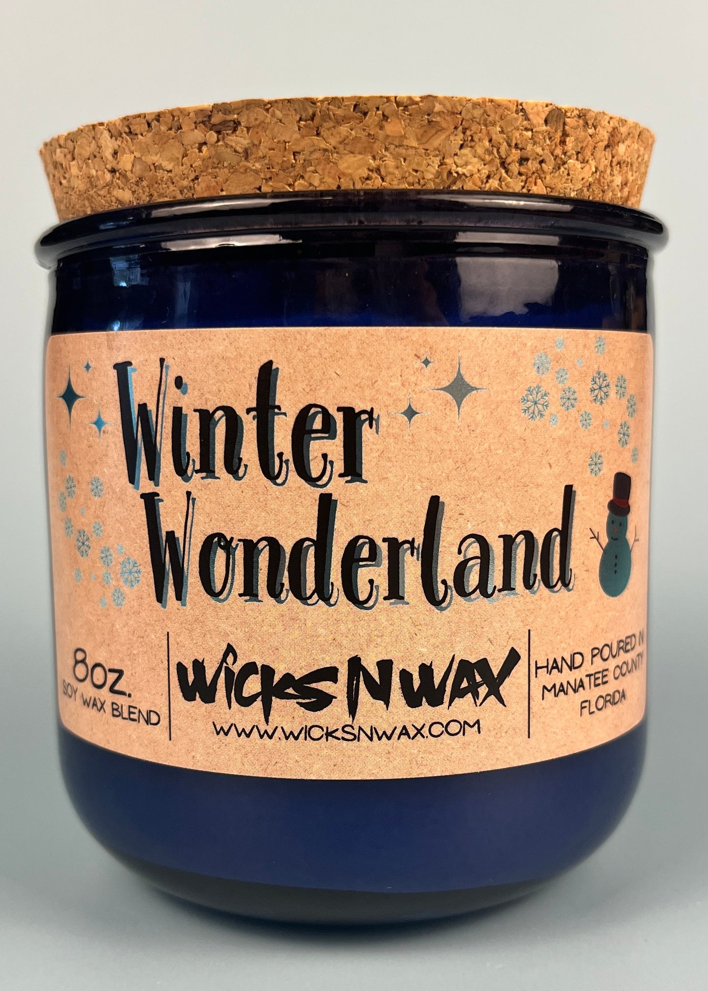 Blue glass candle with cork lid and Winter Wonderland printed label