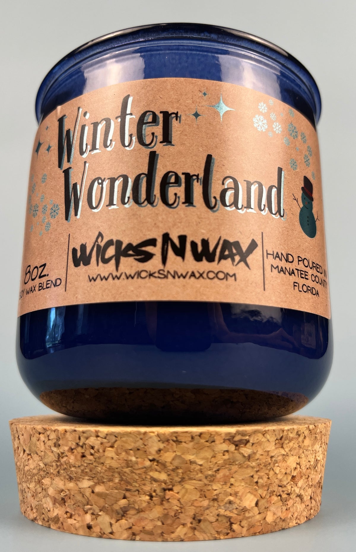 Blue glass candle with cork base and Winter Wonderland label