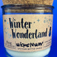 Recycled glass candle with Winter Wonderland label and snowflake icons